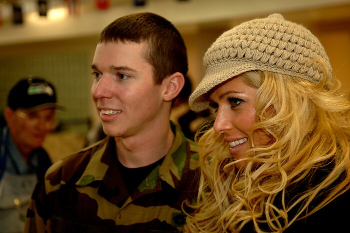 Torrie Wilson, a World Wrestling Entertainment, Inc. star poses for a photo with Airman 1st Class Michael Lewis of the 437th Aerial Port Squadron at the Charleston Air Force Base, S.C., passenger terminal.  The 437th APS hosts the WWE stars and crew before a flight to Ramstein Air Base, Germany, Dec. 5, 2006. The WWE is performing for troops deployed overseas during a holiday tour put together by Armed Forces Entertainment. This will be the fourth time the WWE has teamed with Armed Forces Entertainment to entertain deployed troops.


(RELEASED)(U.S. Air Force photo by Airman 1st Class Nicholas Pilch)