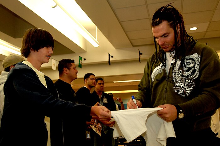 Jeff Hardy, a World Wrestling Entertainment, Inc. star signs a t-shirt for Martin Stockdale at the Charleston Air Force Base, S.C., passenger terminal. The 437th Aerial Port Squadron hosts the WWE stars and crew before a flight to Ramstein Air Base, Germany, Dec. 5, 2006. The WWE is performing for troops deployed overseas during a holiday tour put together by Armed Forces Entertainment. This will be the fourth time the WWE has teamed with Armed Forces Entertainment to entertain deployed troops.


(RELEASED)(U.S. Air Force photo by Airman 1st Class Nicholas Pilch)