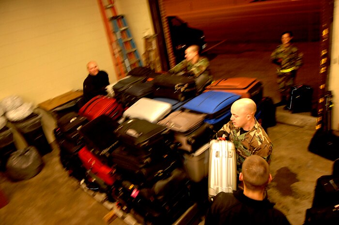 Members of the 437th Aerial Port Squadron load World Wrestling Entertainment, Inc. star's and crew's luggage on a pallet, Charleston Air Force Base, S.C. The 437th APS hosts the WWE stars and crew before a flight to Ramstein Air Base, Germany, Dec. 5, 2006. The WWE is performing for troops deployed overseas during a holiday tour put together by Armed Forces Entertainment. This will be the fourth time the WWE has teamed with Armed Forces Entertainment to entertain deployed troops.


(RELEASED)(U.S. Air Force photo by Airman 1st Class Nicholas Pilch)
