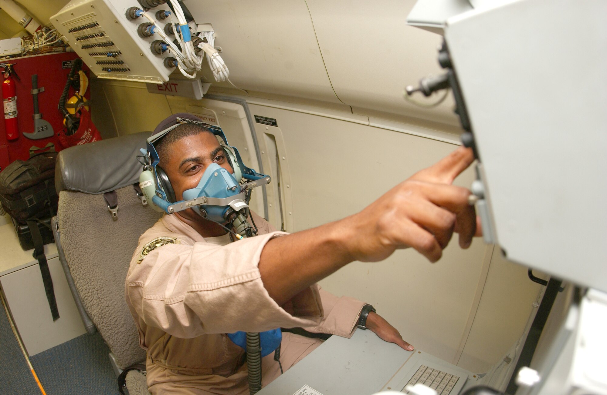 Maj. Sean Godfrey ensures his oxygen mask is in proper working order prior to departure Nov. 30 on an E-8C Joint STARS mission. Major Godfrey is assigned to the 12th Expeditionary Airborne Command and Control Squadron. The flight over Iraq marked 20,000 flying hours in support of Operation Iraqi Freedom by the Boeing 707 equipped with the Joint Surveillance Target Attack Radar System. Accomplishing that feat since early 2003 have been the combined efforts of the 12th EACCS, 16th EACCS and 128th EACCS, all from Robins Air Force Base, Ga., during alternating 90-day rotations. The JSTARS is an airborne battle management aircraft specializing in command and control, and intelligence, surveillance and reconnaissance gathering. Information gathered is passed in real time to servicemembers on the ground conducting combat operations. (U.S. Air Force photo/Senior Airman Ricky Best)