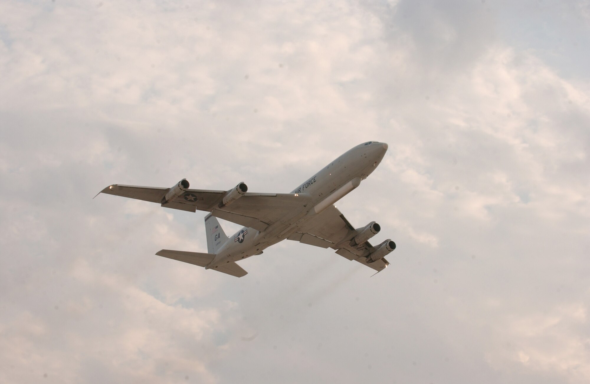 An E-8C Joint STARS aircraft departs from a deployed location in Southwest Asia Nov. 30. The flight over Iraq marked 20,000 flying hours in support of Operation Iraqi Freedom by the Boeing 707 equipped with the Joint Surveillance Target Attack Radar System. Accomplishing that feat since early 2003 have been the combined efforts of the 12th Expeditionary Airborne Command and Control Squadron, 16th EACCS and 128th EACCS, all from Robins Air Force Base, Ga., during alternating 90-day rotations. The JSTARS is an airborne battle management aircraft specializing in command and control, and intelligence, surveillance and reconnaissance gathering. Information gathered is passed in real time to servicemembers on the ground conducting combat operations. (U.S. Air Force photo/Senior Airman Ricky Best) 