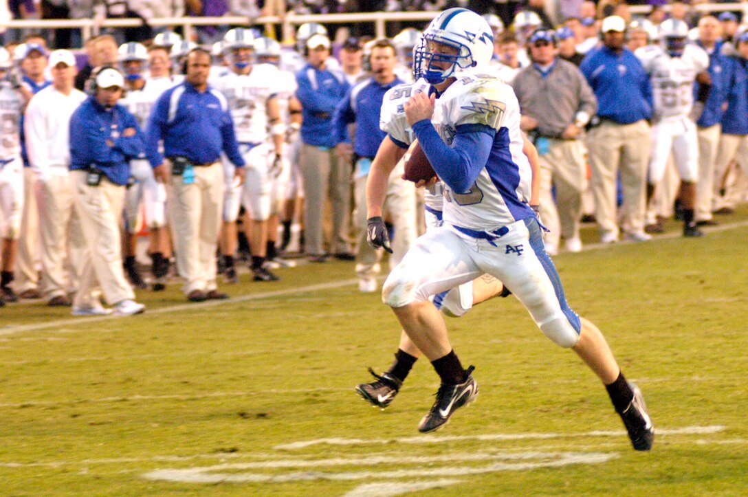 Falcons backup quarterback Jim Ollis races 19 yards for the Air Force's final touchdown of the season late in the fourth quarter in a 38-14 loss to Texas Christian University Dec. 2 in Fort Worth, Texas. (U.S. Air Force photos/Cadet 2nd Class Paul Russo)