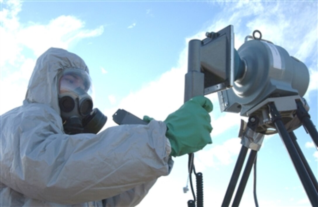 Staff Sgt. Xavier Goco monitors radiation levels at a simulated aircraft crash site on Davis-Monthan Air Force Base, Ariz., Dec. 4 during Vigilant Shield 07. 