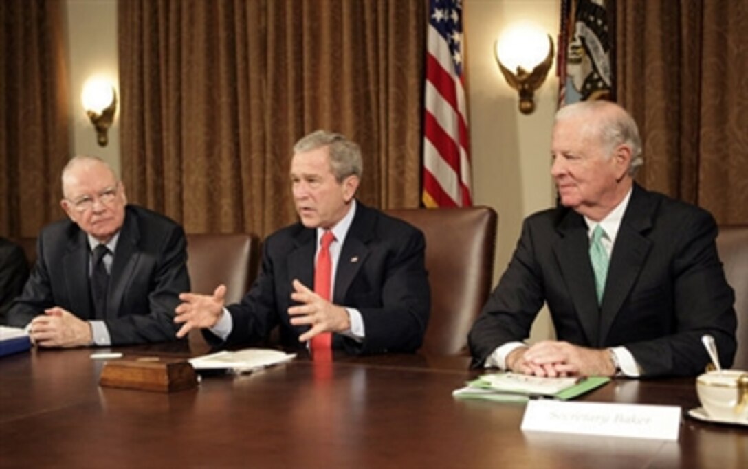 President George W. Bush addresses the press during a meeting with the Iraq Study Group in the Cabinet Room Dec. 6. 2006. Pictured with the president are the group's co-chairmen former Representative Lee Hamilton, left, and former Secretary of State James Baker. 