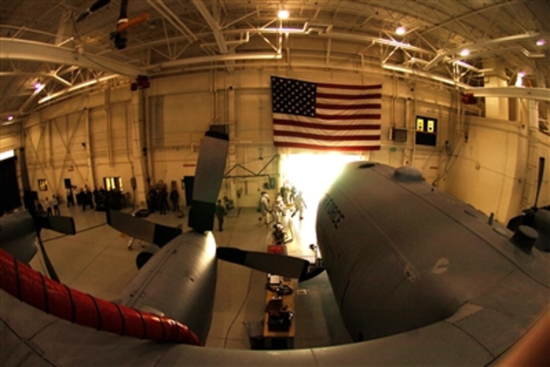 U.S. Air Force firefighters from the 145th Civil Engineering Squadron, firefighters from Charlotte, N.C., and U.S. Army firefighters conduct a joint exercise inside an aircraft hangar in North Carolina, Dec. 3, 2006. 