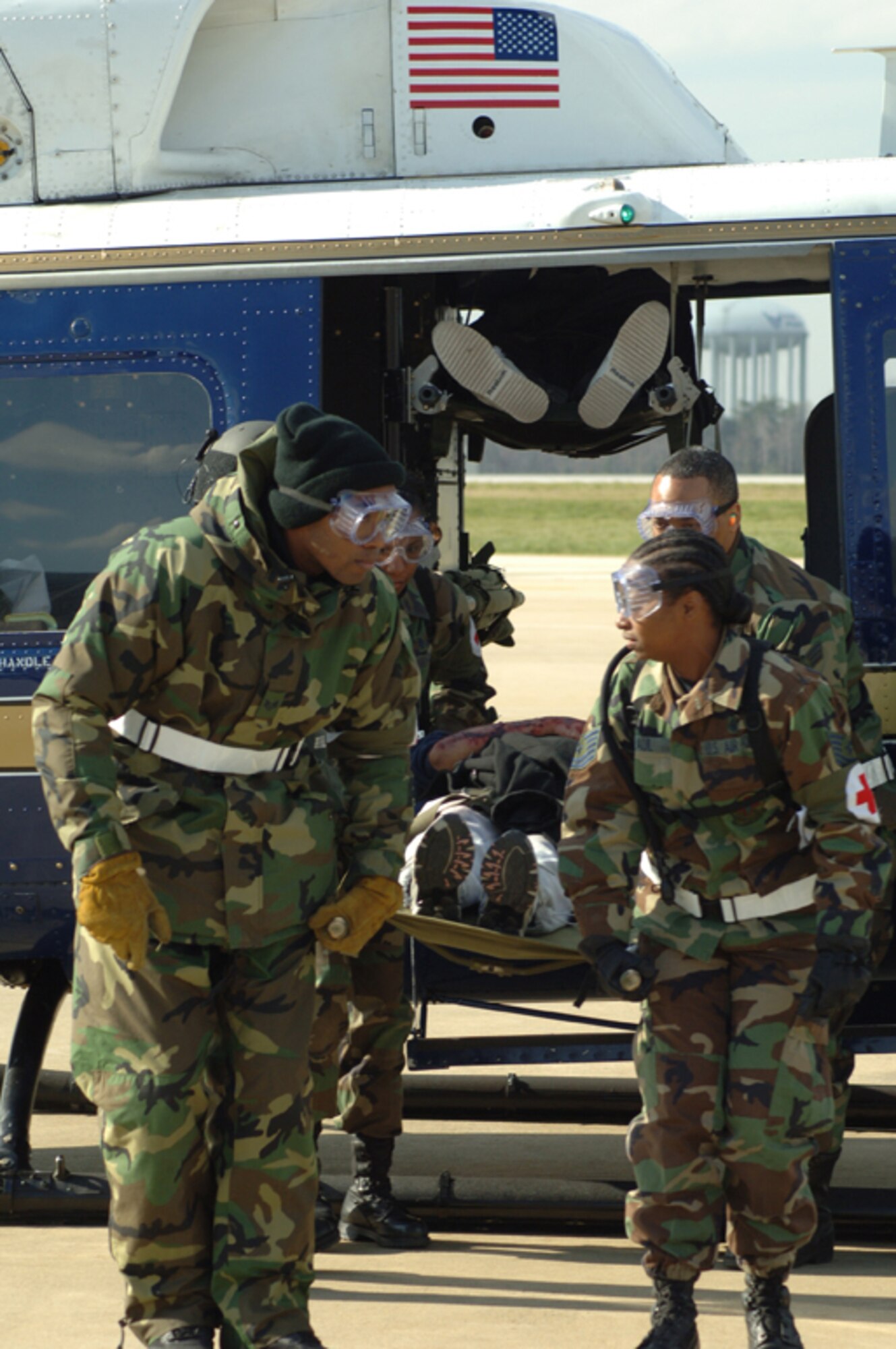 ANDREWS AIR FORCE BASE, Md. -- Medical technicians from the 459th Aeromedical Staging Squadron transport a patient to medical tents from a 316th Airlift Wing 1st Helicopter Squadron chopper. (U.S. Air Force photo/Tech. Sgt. Christopher Matthews)
