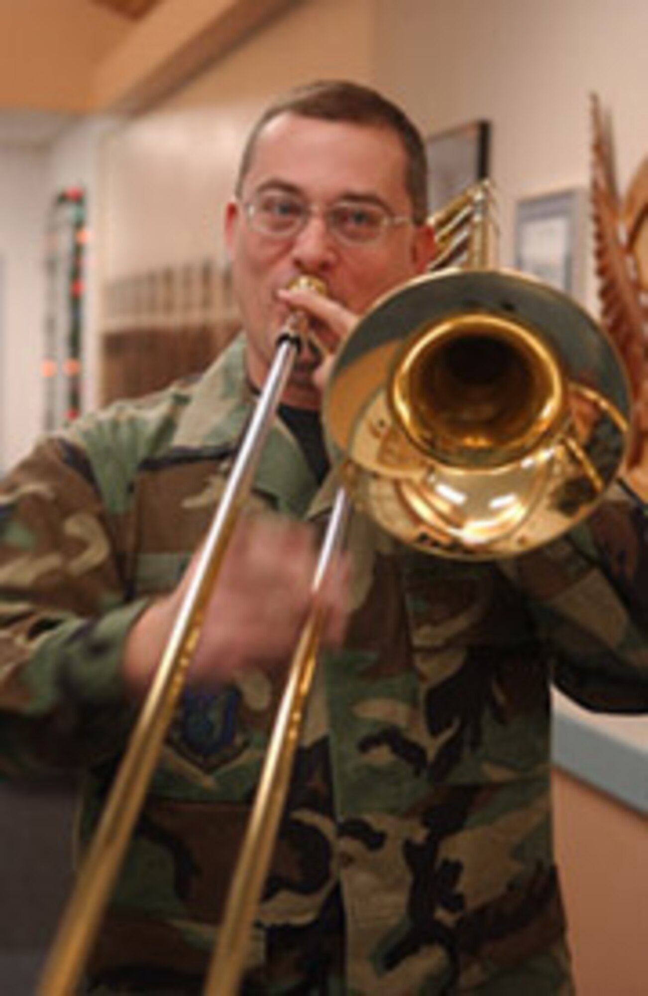 EIELSON AIR FORCE BASE, Alaska--Staff Sgt. William Harris, PACAF Alaska Brass Quintet trombone player, plays Christmas music Dec. 6 at the 355th Fighter Squadron. (U.S. Air Force photo by Senior Airman Anthony Nelson Jr.)
 
