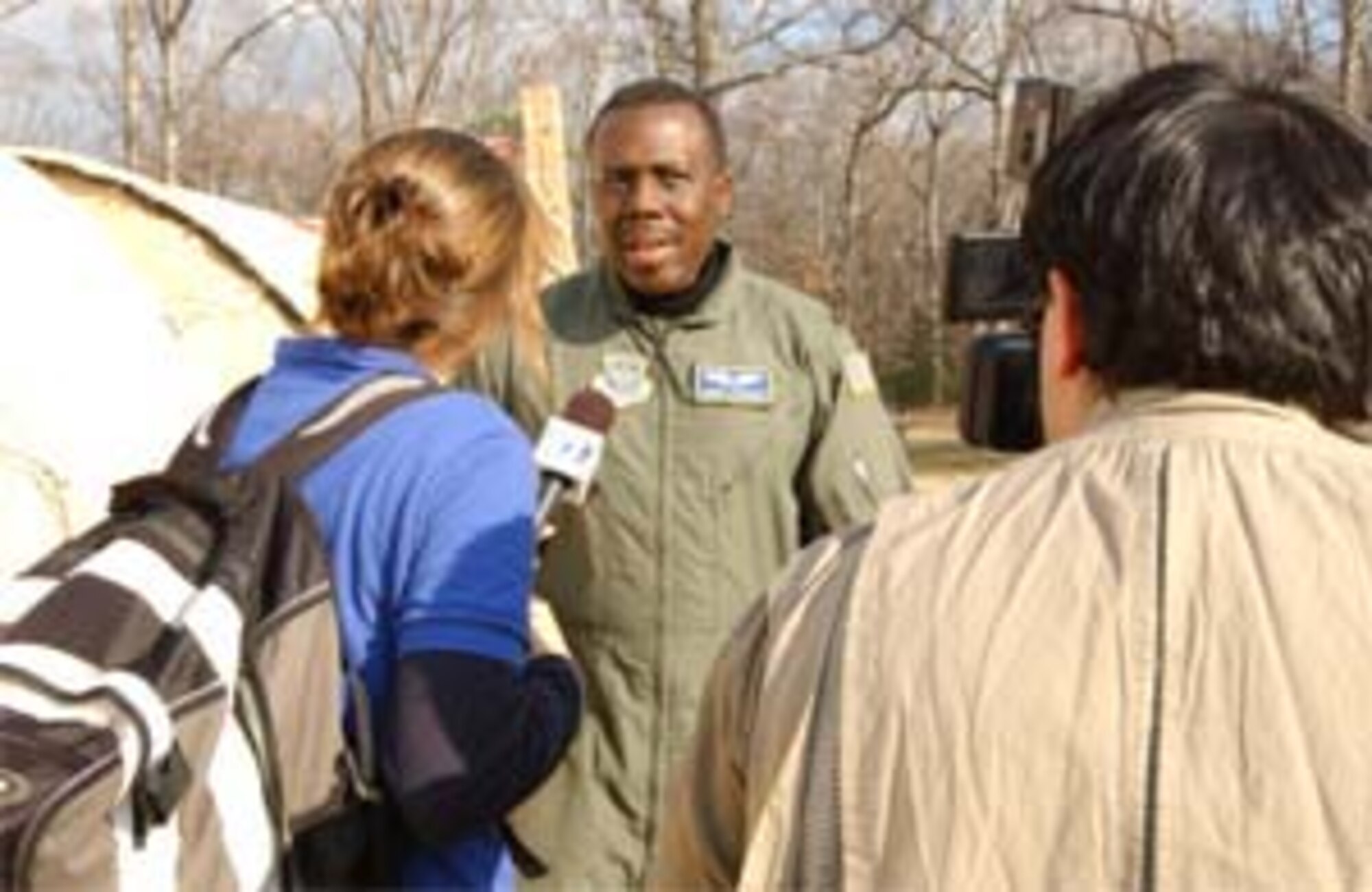 ANDREWS AIR FORCE BASE, Md. -- Lt. Col. Jimmie Drummond, 459th Aeromedical Staging Squadron flight surgeon and exercise contingency aeromedical staging facility commander, talks to local media during Exercise Capital Shield here. Part of the exercise involved evaluating participants' ability to field media inquiries and promote a unified public information awareness message. (U.S. Air Force photo/Staff Sgt. Amaani Lyle)