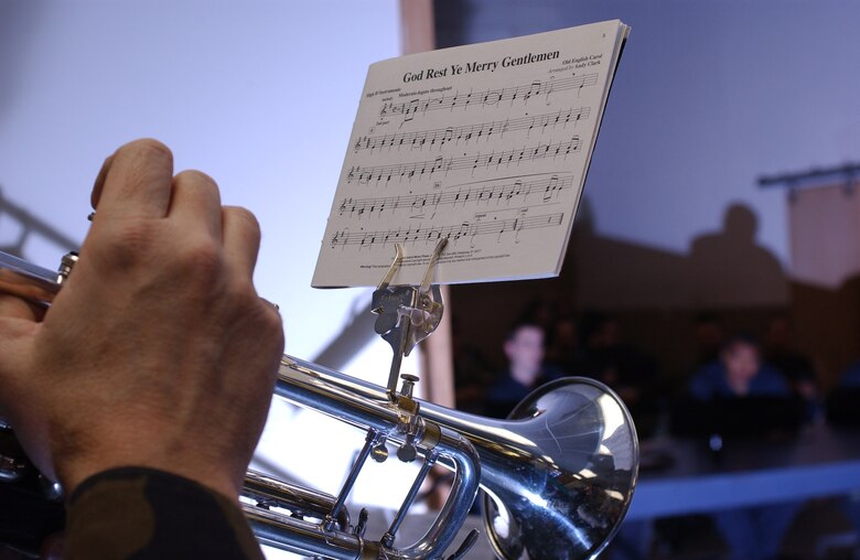 EIELSON AIR FORCE BASE, Alaska -- A member of the PACAF Alaska Brass Quintet plays, "God Rest Ye Merry Gentlemen," on a trumpet here at the 355th Fighter Squadron Dec. 6. (U.S. Air Force photo by Senior Airman Anthony Nelson.)