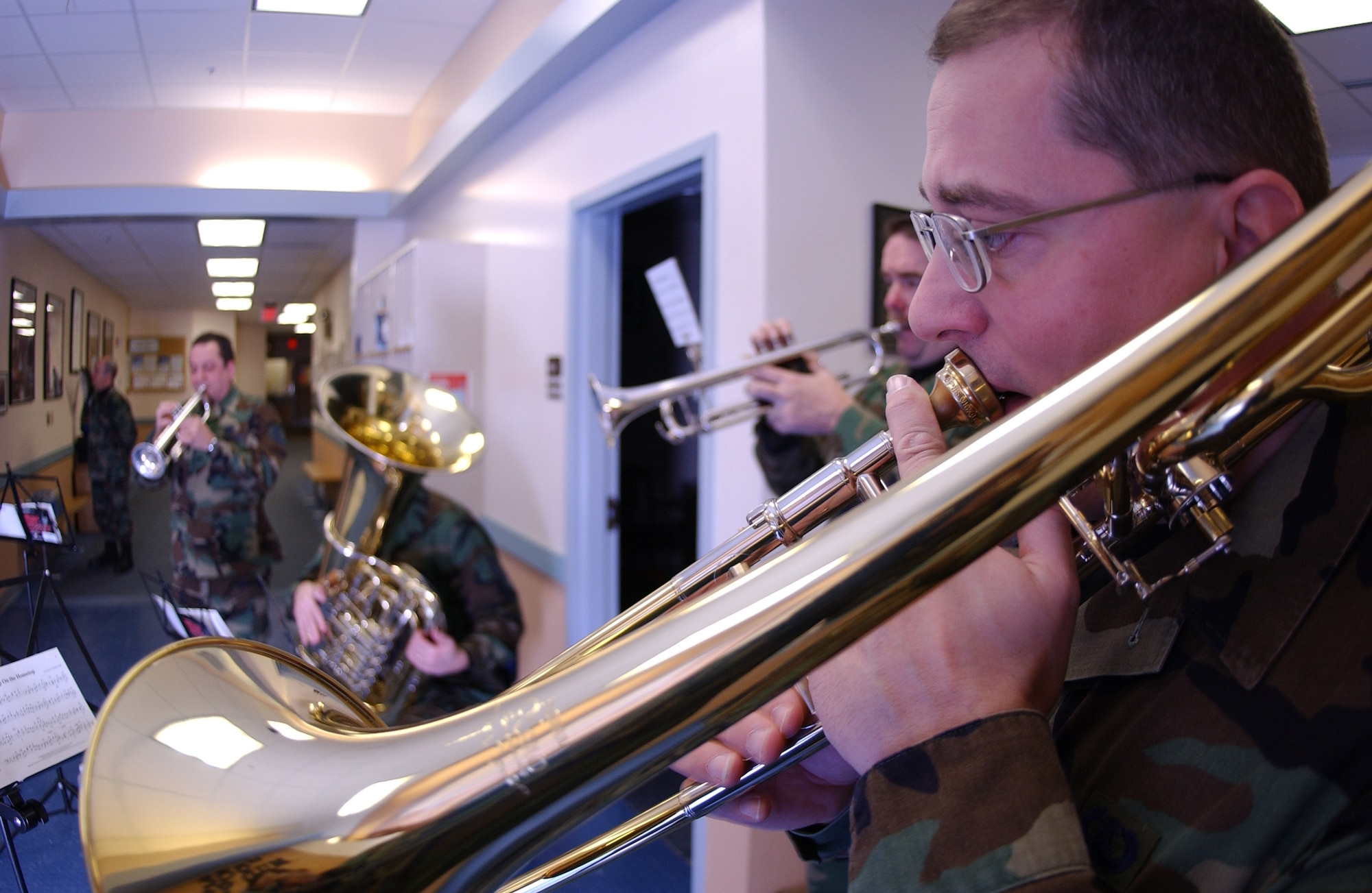 EIELSON AIR FORCE BASE, Alaska-- Staff Sgt. William Harris and members of the PACAF Alaska Brass Quintet play "Holiday favorites" here at the 355th Fighter Squadron. (U.S. Air Force photo by Senior Airman Anthony Nelson.)
