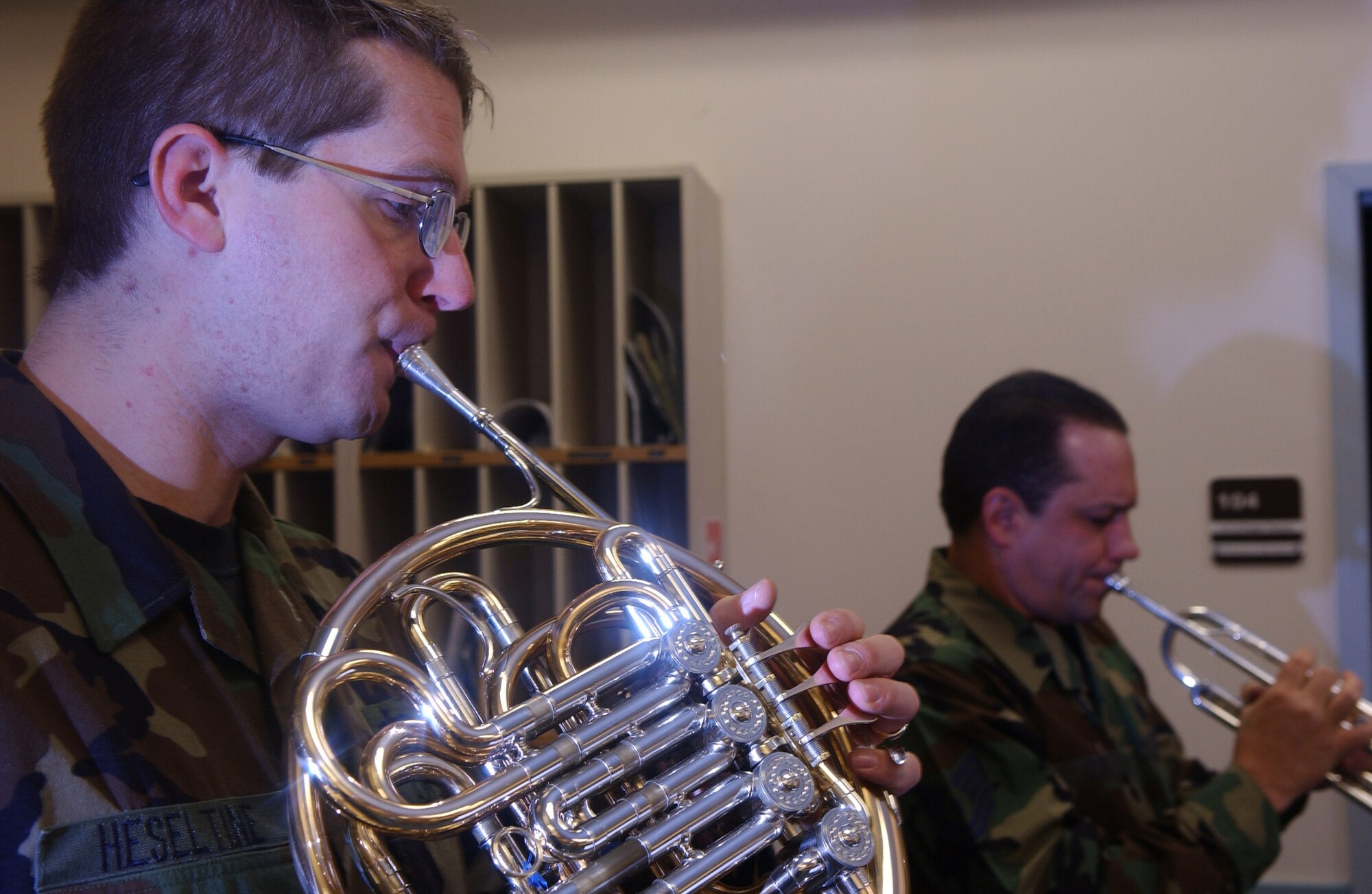 EIELSON AIR FORCE BASE, Alaska -- Staff Sgt. Patrick Heseltine, PACAF Alaska Brass Quintet member, plays a Christmas carol from his french horn at the 355th Fighter Squadron Dec. 6. (U.S. Air Force photo by Senior Airman Anthony Nelson.)

 
