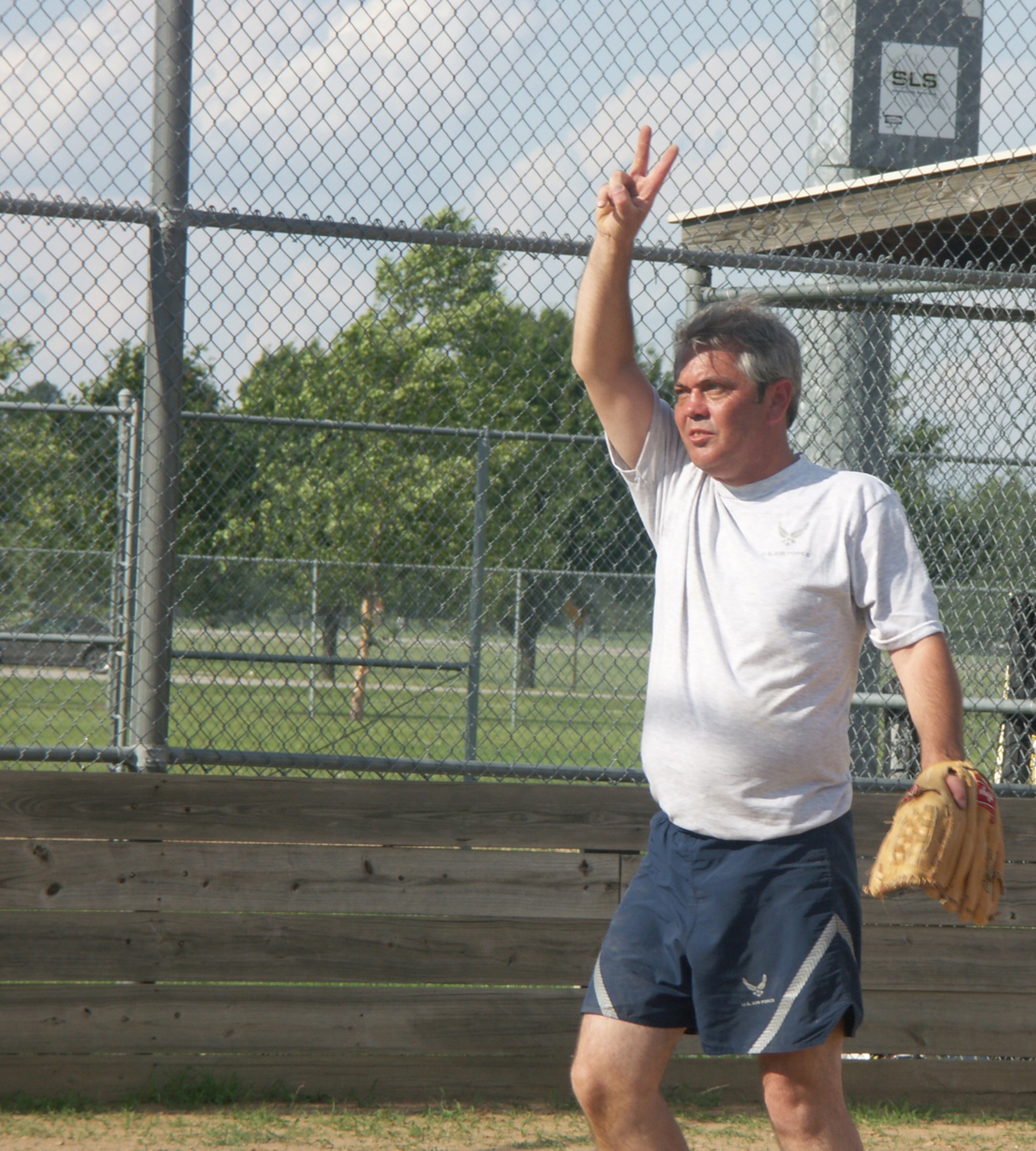 Enlisted are strong in softball as shown by the secret signals sent out by Senior Master Sgt. Ron Peterson at the wing summer picnic.  This is a competitive sport at the 932nd Airlift Wing!  Photo/ Tech Sgt. Dan Oliver