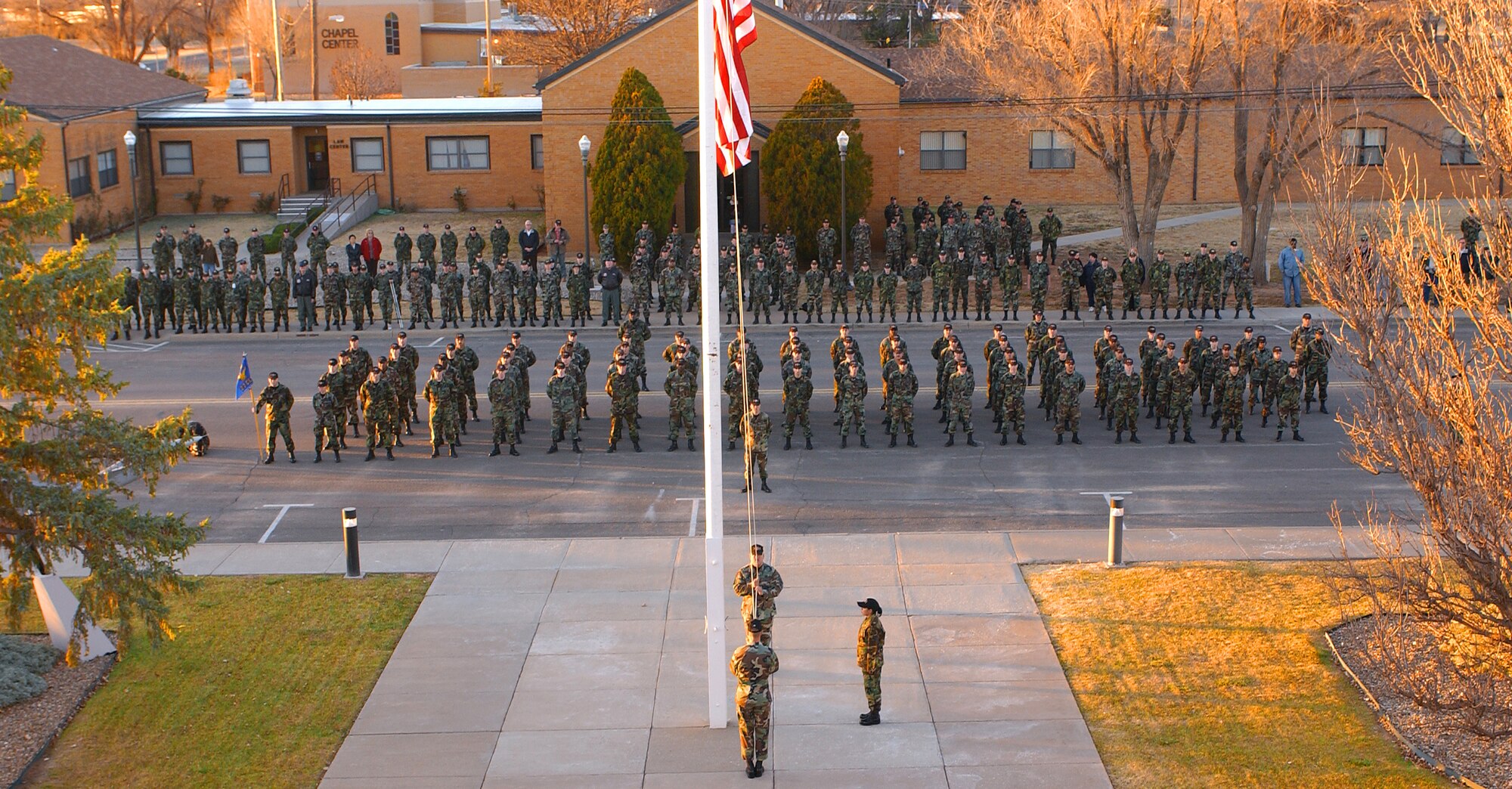 Airmen from the 27th Civil Engineer Squadron perform a special retreat ceremony Dec. 6 in honor of their comrade Capt. Kermit Evans who was killed in an emergency helicopter landing Dec. 3. Captain Evans was one of 16 people aboard the Marine CH-46 helicopter and one of four servicemembers killed as a result of the landing near the shore of Lake Qadisiyah in western Al Anbar Province, Iraq. Captain Evans was the 27th CES Explosives Ordnance Disposal Flight commander at Cannon Air Force Base, N.M.  (U.S. Air Force photo/ Airman 1st Class Randi Rickards) 