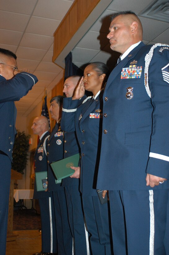 301st Fighter Wing Honor Guard members receive the Army Commendation Medal from Col. Max Mendoza, 301st Mission Support Squadron commander, at the recent Honor Guard banquet. Also receiving the 2005 Honor Guard Member of the Year is Master Sgt. Jose Munzo, Jr., right. U.S. Air Force Photo/Tech. Sgt. Julie Briden-Garcia.