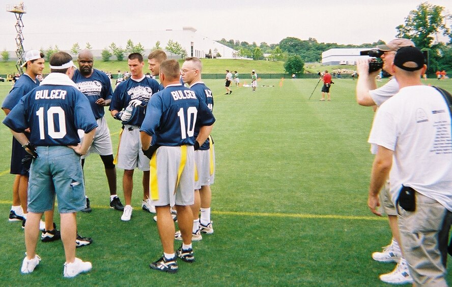 Pro Bowl St. Louis Rams quarterback Marc Bulger gathers his team to prepare for the competition.  Flag football out at Rams Park involved inviting members of the 932nd Airlift Wing to play in Kurt Warner's foundation, First Things First Ultimate Football event.  The Air Force Reservists were able to "draft" Marc Bulger to be their quarterback for the competition.
