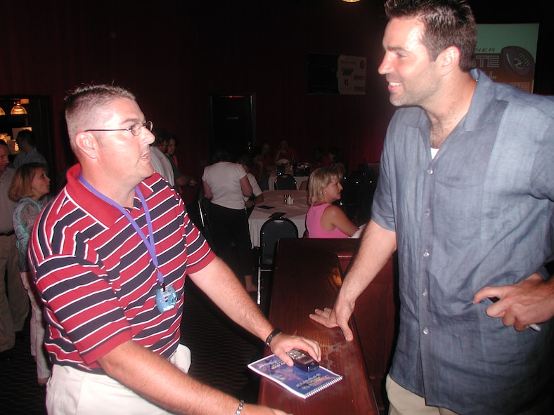 Senior Master Sgt. Todd Wadkins shares a laugh with NFL great Kurt Warner in St. Louis.  Flag football out at Rams Park involved inviting members of the 932nd Airlift Wing to play in Kurt Warner's foundation, First Things First Ultimate Football event.  The Air Force Reservists were later able to get enough points "draft" Marc Bulger to be their quarterback for the competition.