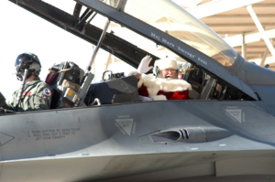 Temporarily trading his sleigh for an F-16 fighter jet, Santa was able to make a special visit to the children of 301st Fighter Wing members at Naval Air Station Joint Reserve Base Fort Worth, Texas, during the December Unit Training Assembly weekend. U.S. Air Force Photo/Tech. Sgt. Julie Briden-Garcia.