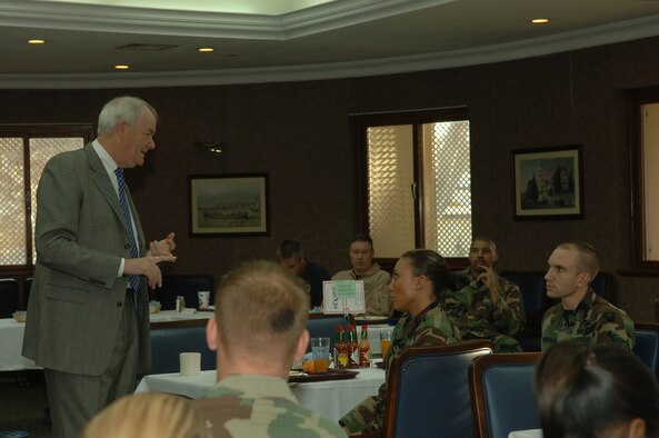 Secretary of the Air Force Michael Wynne meets with Airmen for breakfast at the Sultan's Inn dining facility, Dec. 7. After breakfast, Airmen were able to ask the secretary questions and have a photo taken with him. (U.S. Air Force photo by Airman Kelly L. LeGuillon) 