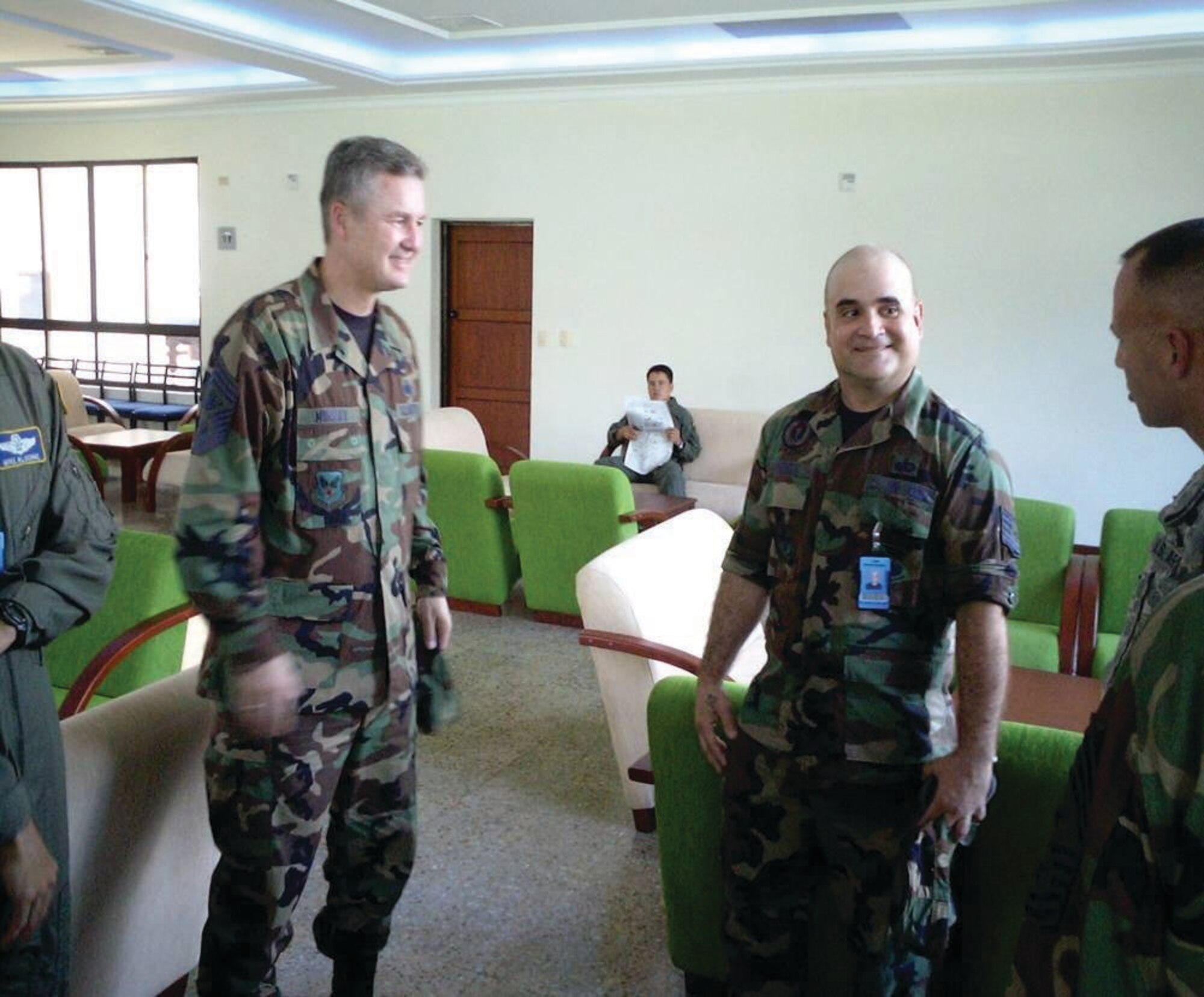 BOGATA, Columbia --  Tech. Sgt. Irizarry Merced talks with former Chief Master Sgt. of the Air Force Gerald Murray and other command chiefs while deployed here. (Courtesy photo)