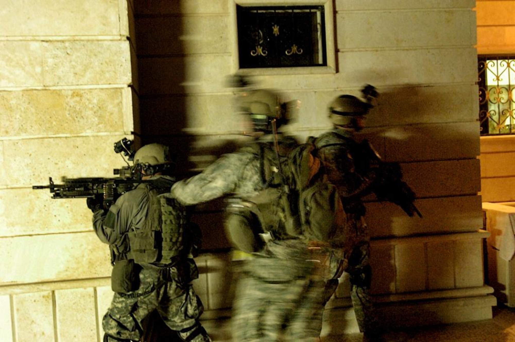 BAGHDAD, Iraq -- After receiving highly reliable information from the Fusion Cell and other intelligence sources, Coalition Forces prepare to launch an assault on a suspected terrorist occupied building. (file photo)