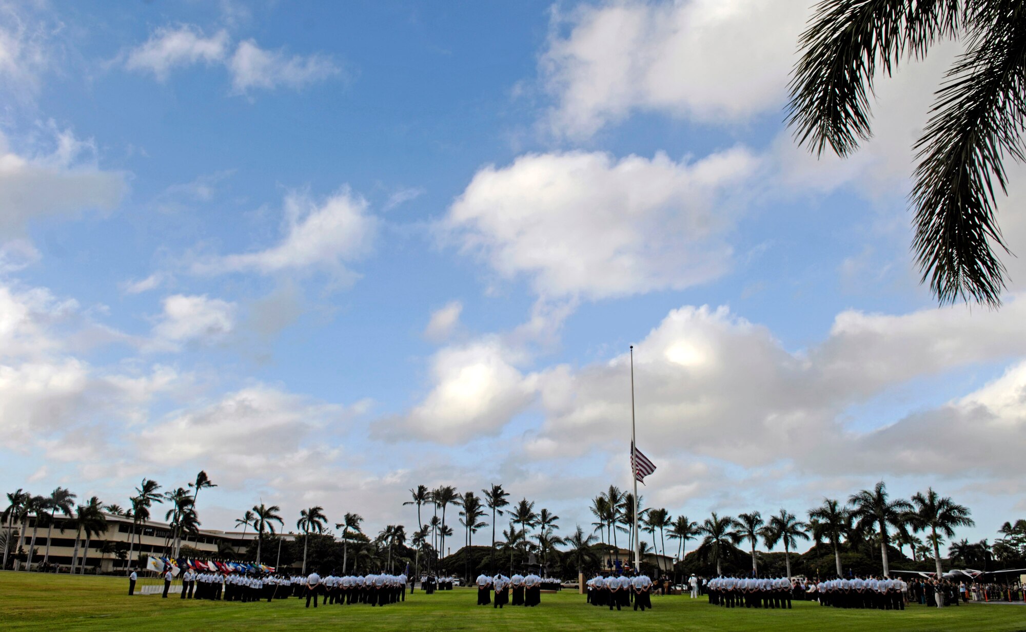 A ceremony at the Hickam Air Force Base, Hawaii, flagpole was held Dec. 7 to honor the 189 who died and 303 who were wounded during a surprise attack by Japanese fighter aircraft 65 years ago.  The consolidated barracks, what is now the Pacific Air Forces headquarters, was reportedly the most bombed building on Oahu. (U.S. Air Force photo/Tech. Sgt. Shane A. Cuomo) 