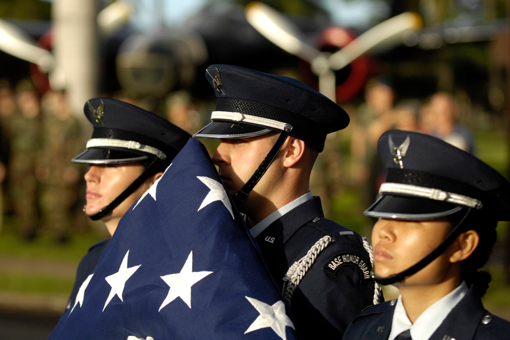 A ceremony at the Hickam Air Force Base, Hawaii, flagpole was held Dec. 7 to honor the 189 who died and 303 who were wounded during a surprise attack by Japanese fighter aircraft 65 years ago.  (U.S. Air Force photo/Tech. Sgt. Shane A. Cuomo) 


