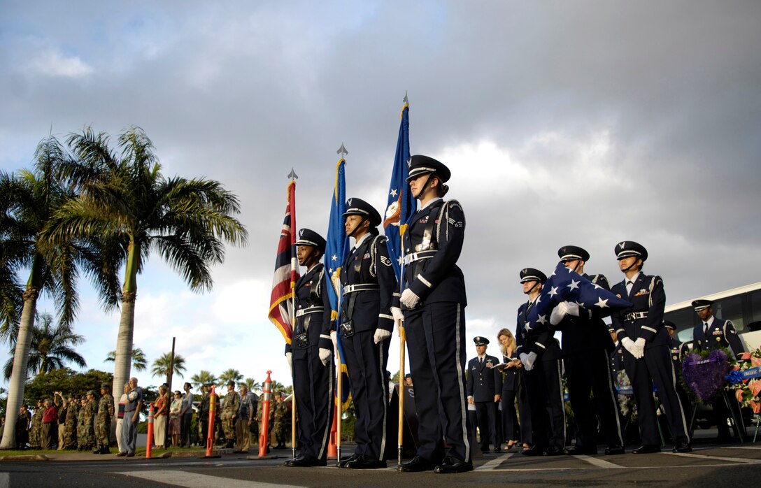 A ceremony at the Hickam Air Force Base, Hawaii, flagpole was held Dec. 7 to honor the 189 who died and 303 who were wounded during a surprise attack by Japanese fighter aircraft 65 years ago.  The consolidated barracks, what is now the Pacific Air Forces headquarters, was reportedly the most bombed building on Oahu. (U.S. Air Force photo/Tech. Sgt. Shane A. Cuomo) 