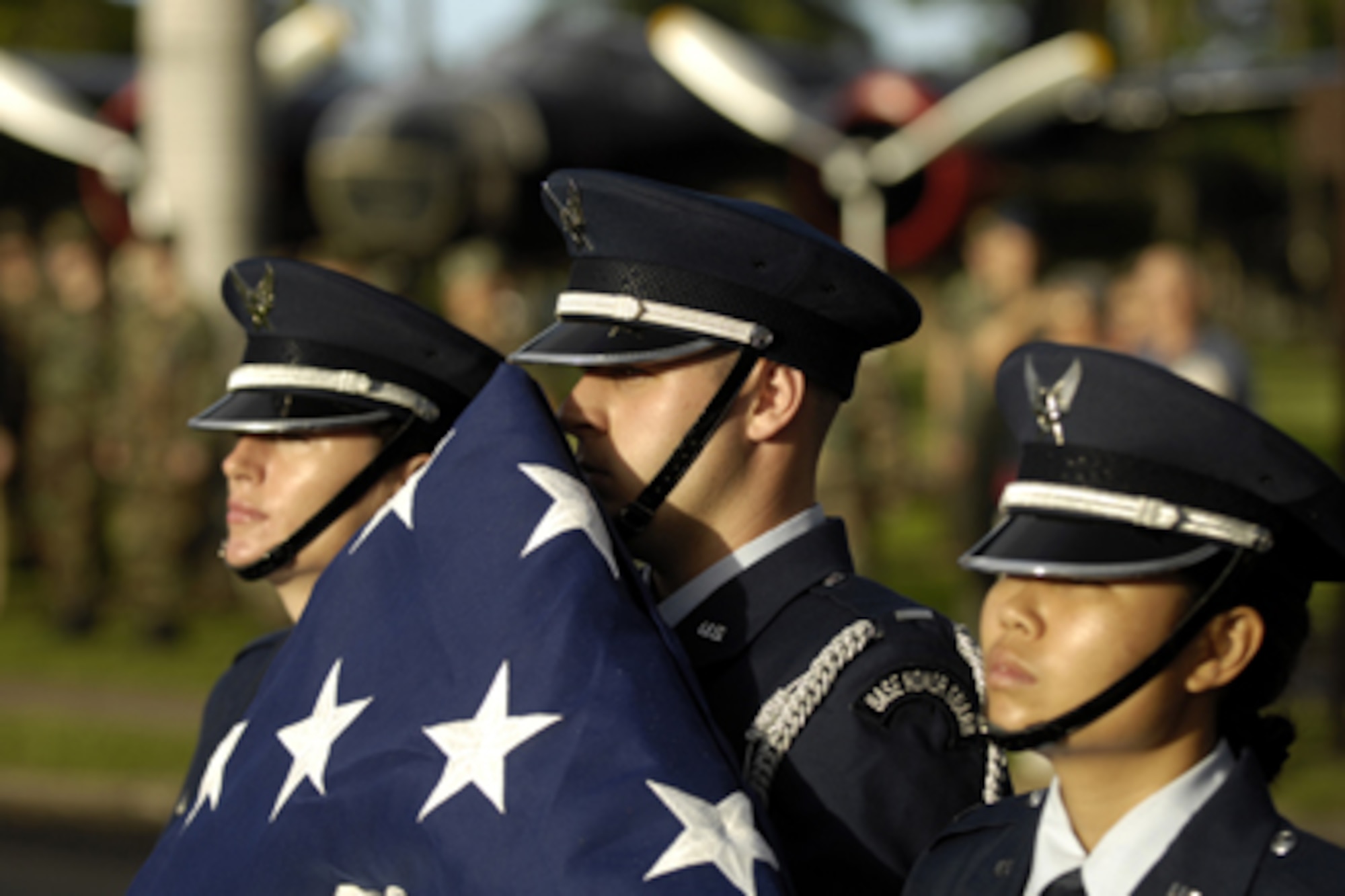 Members from the 15th Airlift Wing base honor guard commemorate the 65th anniversary of the Dec. 7, 1941 surprise Japanese attack at Hickam Air Force Base, Hawaii Dec. 7, 2006. The base held a ceremony at the base flagpole to honor the attack on then Hickam Field, which left 189 dead and 303 wounded. The consolidated barracks what is now the Pacific Air Forces Headquarters was reportedly the most bombed building on Oahu. (U.S. Air Force photo/ Tech. Sgt. Shane A. Cuomo)

