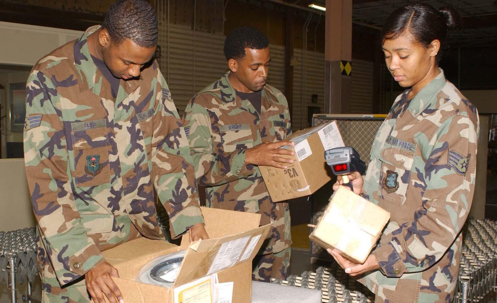 From left, Senior Airman Charles Lewis and Staff Sgts. Tamorrace Wright and Toyshaline Young, 81st Supply Squadron, check in mission-capable parts inside their warehouse. The 81st Supply Squadron made Keesler logistical history Nov. 27 when all 18 of the 403rd Wing’s C-130J aircraft and other reportable systems attached to them, remained fully mission capable for five consecutive days. (U.S. Air Force photo by Kemberly Groue)