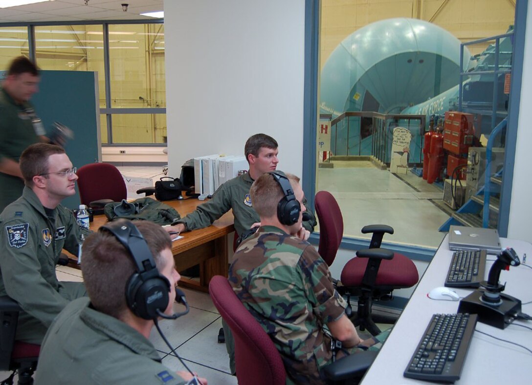 The HAVE BAT team studies the effects of imposing boundaries on a dynamic point-tracking in flight. The team is composed of U.S. Air Force Test Pilot School Class 06A students who graduated Dec. 9, 2006. (Photo by Capt. Jason Dotter)