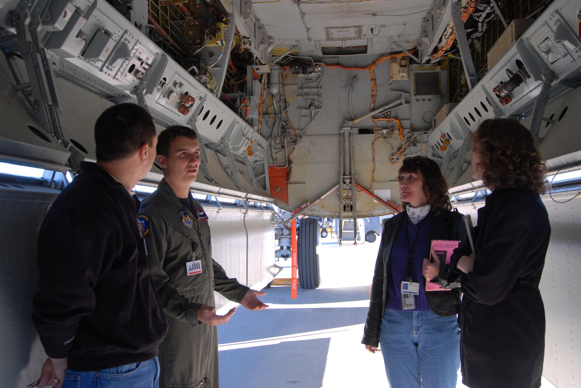 Capt. Miles Middleton, 419th Flight Test Squadron B-52H test project officer and pilot, shows students from the University of Idaho equipment in the weapons bay of a B-52 here Dec. 5, 2006. (Photo by Airman Stacy Sanchez)