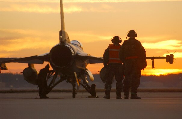 Tech. Sgt. Aubrey Dickerson and Master Sgt. Tracey Shook prepare to launch an F-16 Fighting Falcon on a sortie in support of a Phase 2 exercise recently at Shaw Air Force Base, S.C. The war-like exercise prepares Airmen for deployments. (U.S. Air Force photo/Staff Sgt. Nathan Bevier) 
