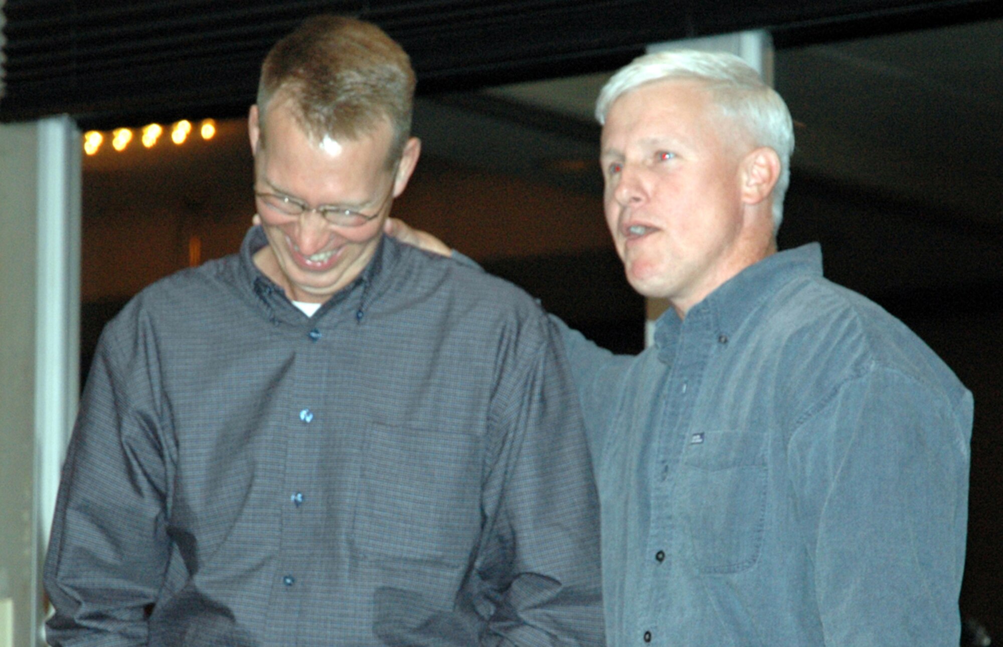Chief Master Sgt. Todd Small (left), 1st Special Operations Wing command chief, was honored by Col. Norman Brozenick Jr. 1st SOW commander, during Chief Small's going away dinner Nov. 27 at The Soundside. (U.S. Air Force Photograph by Senior Airman James Dickens)