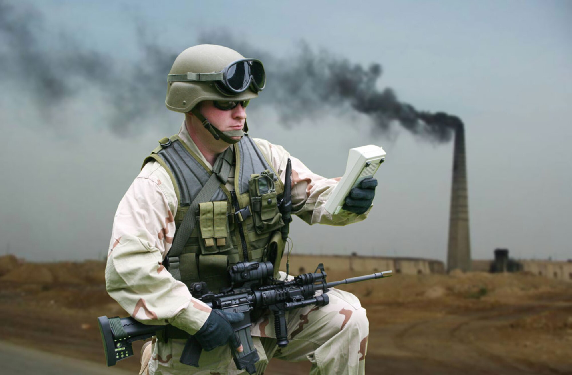 This photo illustration depicts how a warfighter would use a hand-held monitor to determine exposure levels to biological or chemical warfare agents in the field.  