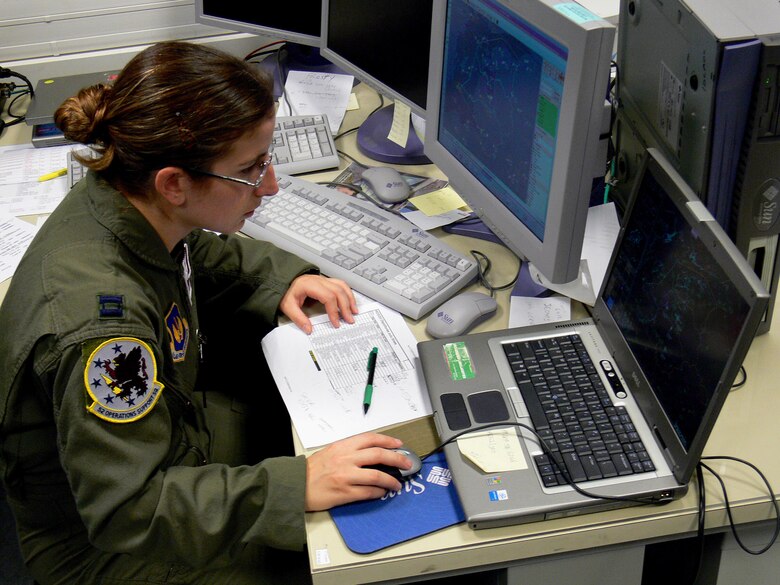 Capt. Julie Sposito monitors the sky over the Baltic region Nov. 28. Captain Sposito is from the 52nd Operations Support Squadron at Spangdahlem Air Base, Germany, and served as senior director in the Combined Joint Air Operations Center in Riga, Latvia. NATO leaders from 26 nations met in Latvia for NATO's Riga Summit Nov. 28 and 29. (U.S. Air Force photo/Maj. Lisa Neidinger) 
