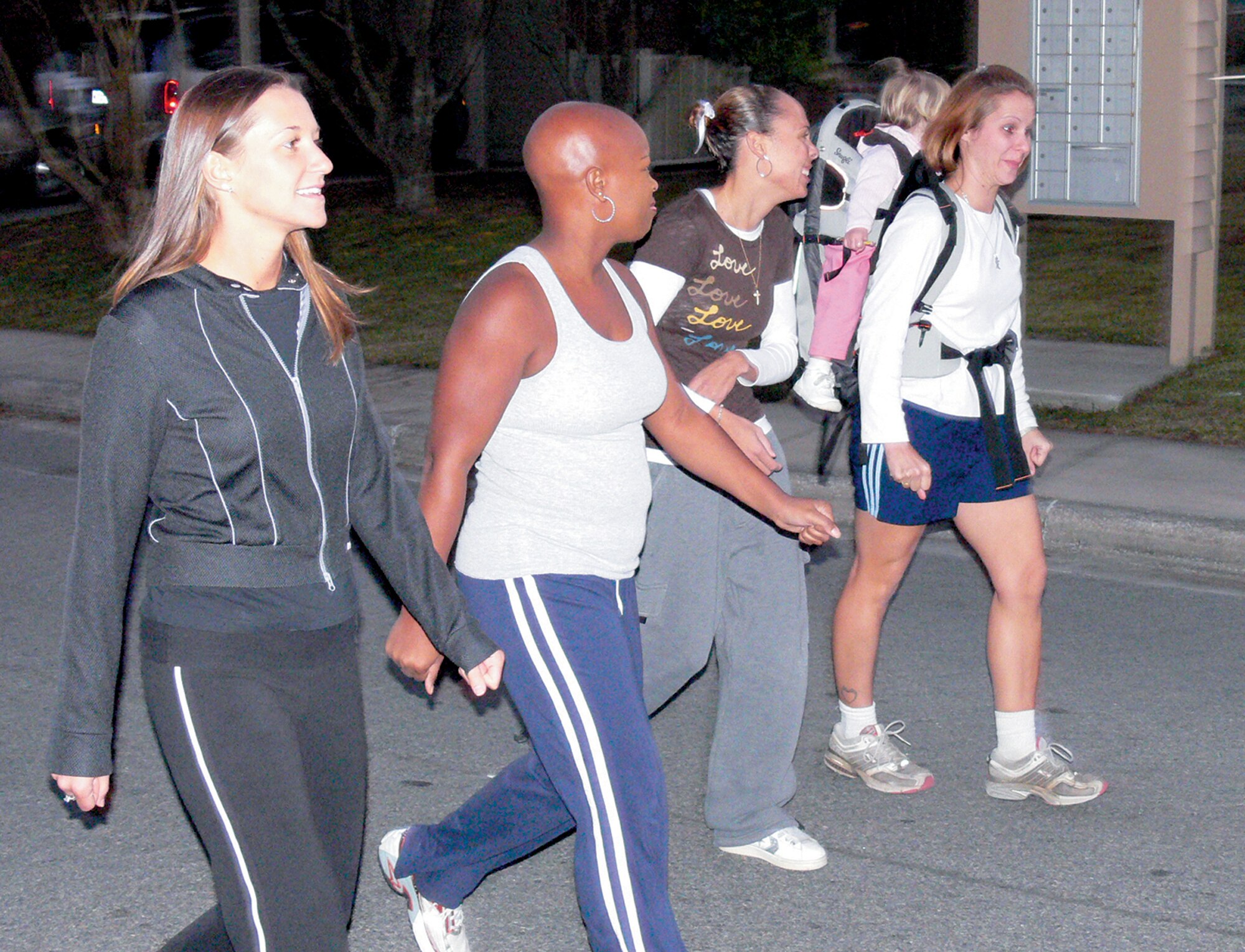 (From left) Lisa Broussard, Joy Myers, Antonette Johnson and Jennifer Slatery, participants in the Inching Toward Iraq Program, exercise in Moody’s Quiet Pines housing community. Even though the program has concluded, these women continue to find motivation to pursue a healthy lifestyle. (U.S. Air Force photo by Airman 1st Class Eric Schloeffel) 