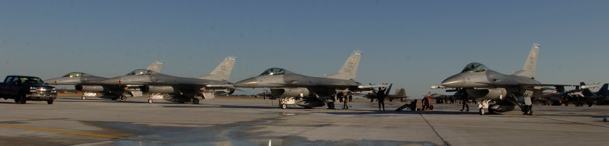 F-16's from the 523 Fighter Squadron prepare to launch for dissimilar aircraft training at Langley Air Force Base, Virginia, December 4, 2006.  (US Air Force photo by Airman First Class Christopher L. Ingersoll)