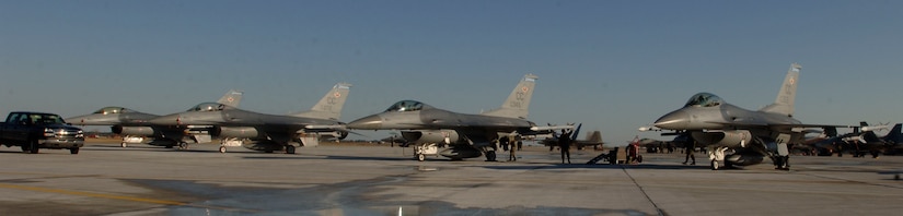 F-16's from the 523 Fighter Squadron prepare to launch for dissimilar aircraft training at Langley Air Force Base, Virginia, December 4, 2006.  (US Air Force photo by Airman First Class Christopher L. Ingersoll)