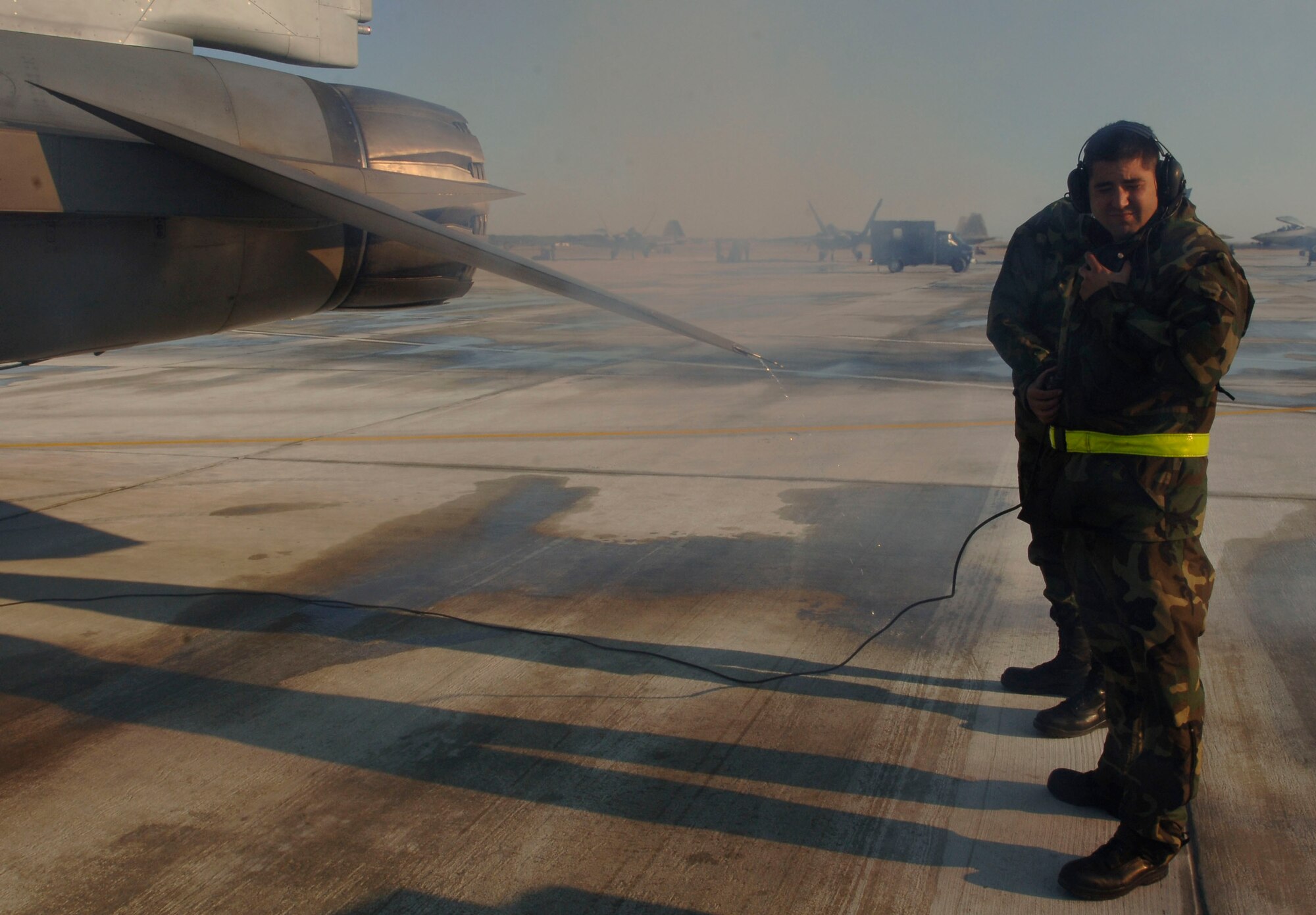 Crew Chief Staff Sergeant Michael Brooks from the 524 Aircraft Maintenance Unit  prepares to launch his F-16 for dissimilar aircraft training at Langley Air Force Base, Virginia, December 4, 2006.  (US Air Force photo by Airman First Class Christopher L. Ingersoll)