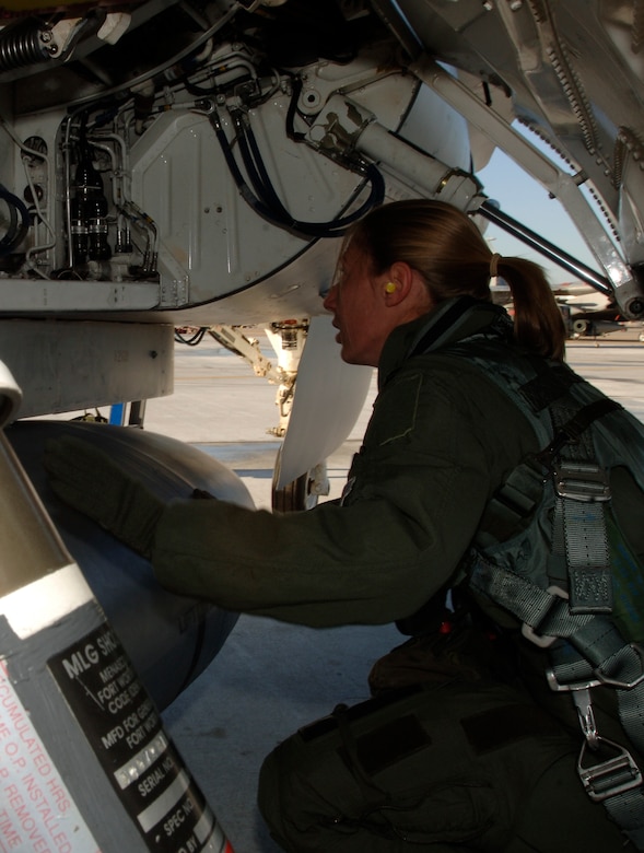 Captain Katherine Gaetke, F-16 pilot from the 523 Fighter Squadron prepares to fly dissimilar aircraft training at Langley Air Force Base, Virginia, December 4, 2006.  (US Air Force photo by Airman First Class Christopher L. Ingersoll)