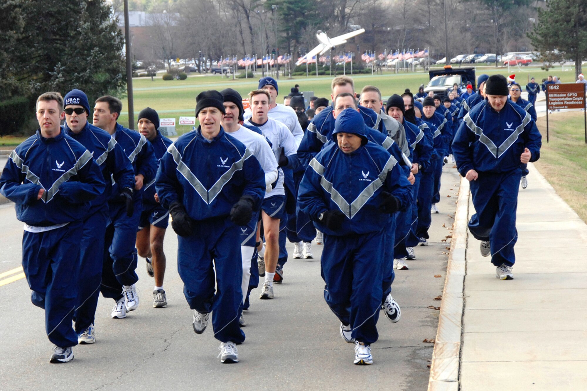 Members of the 350th Electronic Systems Wing run in formation during the Electronic Systems Center Integration Week 5K Fun Run and Walk held here Monday. More than 330 base personnel registered to participate in the event. (US Air Force Photo by Jan Abate)
