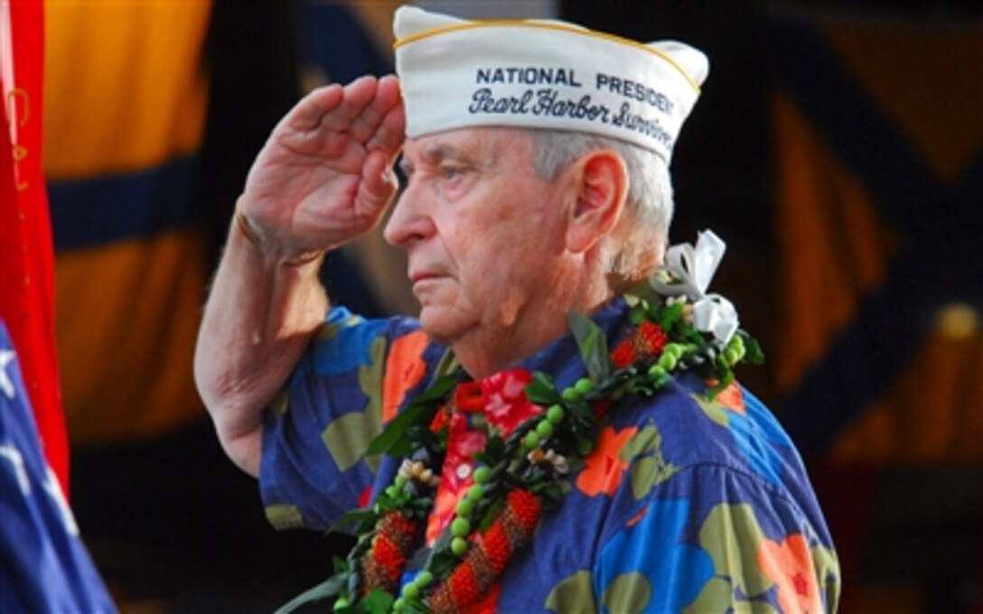 Mal Middlesworth, president Pearl Harbor Survivor Association, renders a salute to U.S. Navy sailors aboard the destroyer USS Russell during the joint U.S. Navy/National Park Service ceremony commemorating the 65th anniversary of the attack on Pearl Harbor on Naval Station Pearl Harbor, Hawaii, Dec. 7, 2006. 