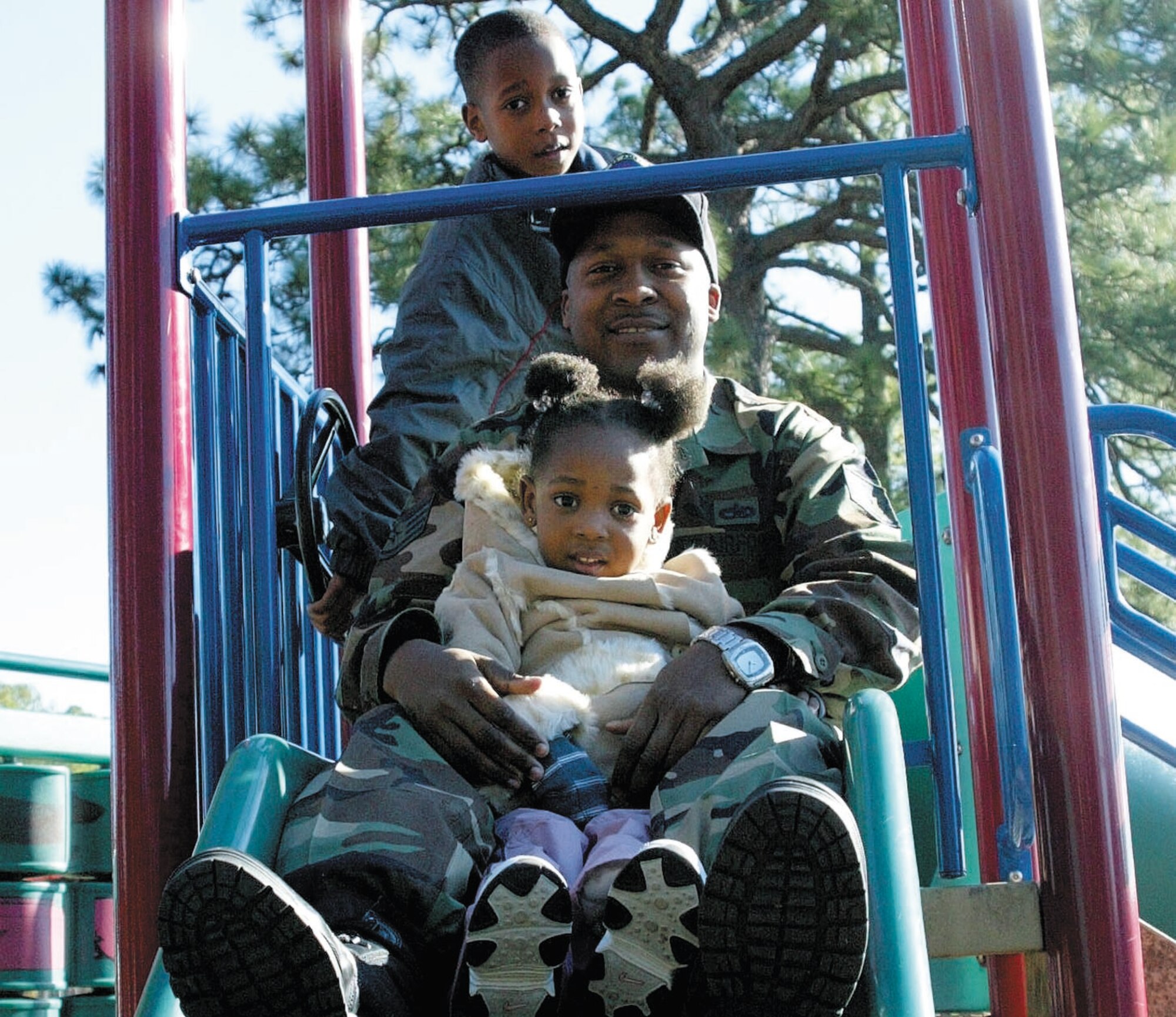 Staff Sgt. Sean Harris, 23rd Aircraft Maintenance Squadron, enjoys a day at the park with son, Sean, 6, and daughter, Jiana, 2. Sergeant Harris' wife, Staff Sgt. Melinda Harris, recently deployed from the 2nd Airlift Squadron.