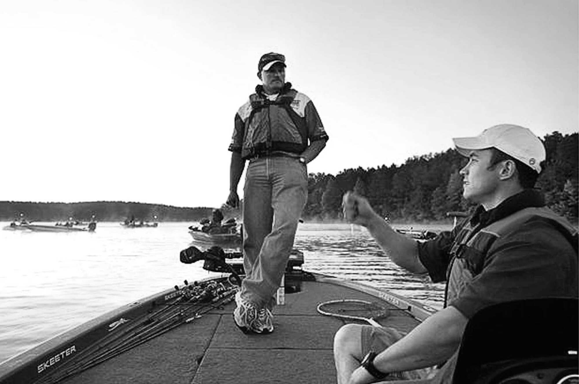 Josh Planc, an airman in the Air Force, takes a moment to quiz his fishing guide James Poirrier Friday morning on Shearon Harris Lake before the start to the 1st Annual Warriors On The Water Military Appreciation Bass Tournament.  The tournament is a way for the fishermen to say thank you to the soldiers for the job they do.