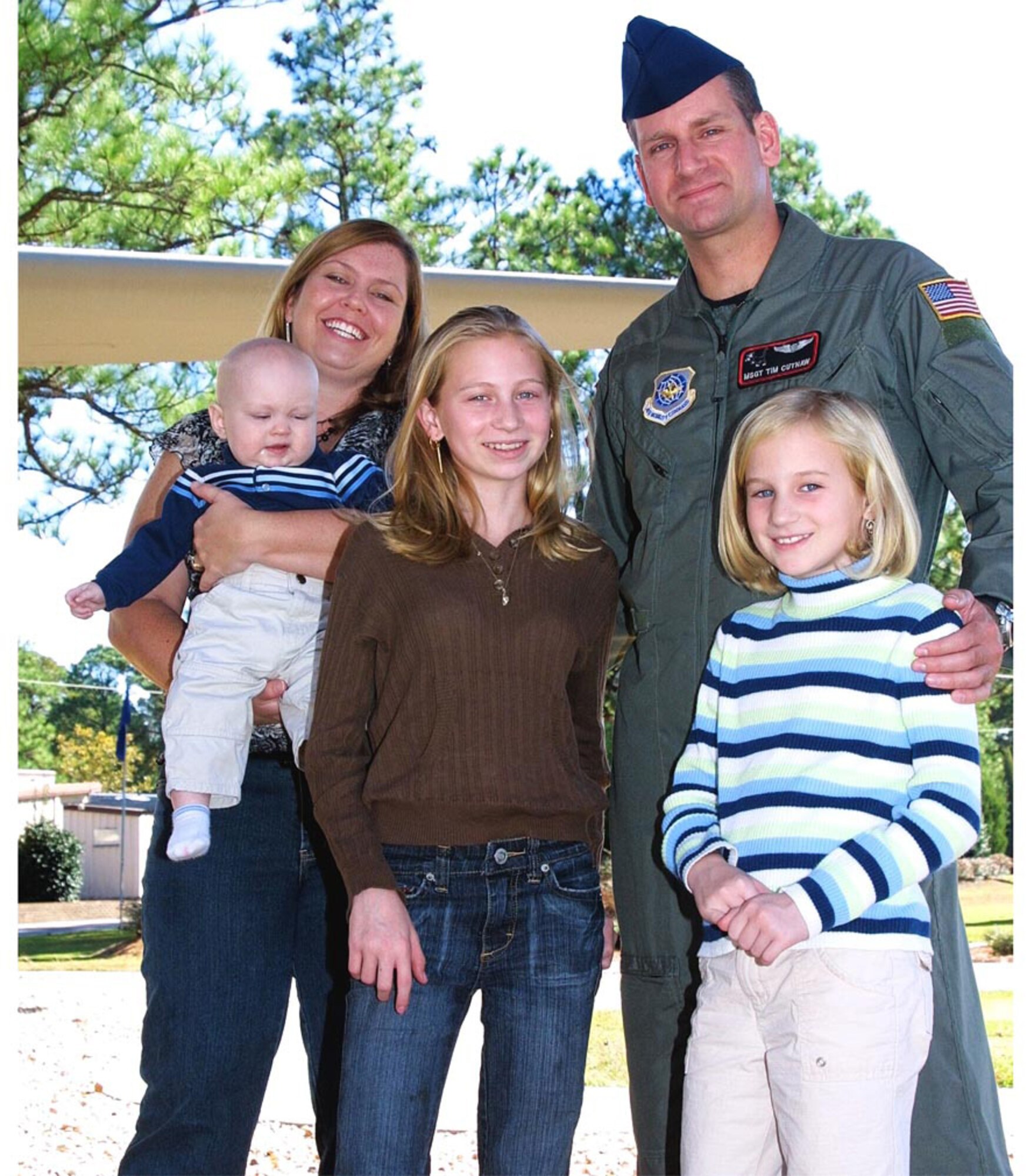 Master Sgt. Timothy Cutnaw, 41st Airlift Squadron, his wife,  XXX, and their three children, Kaliegh, 12; Katie, 8; and Billy, 7 months, spend time at the Pope Air Park. They put special time away to connected as a family by going to the park, grabbing ice cream at Rockfish or playing video games together. (U.S. Air Force photo/Senior Airman Cassandra Locke)
