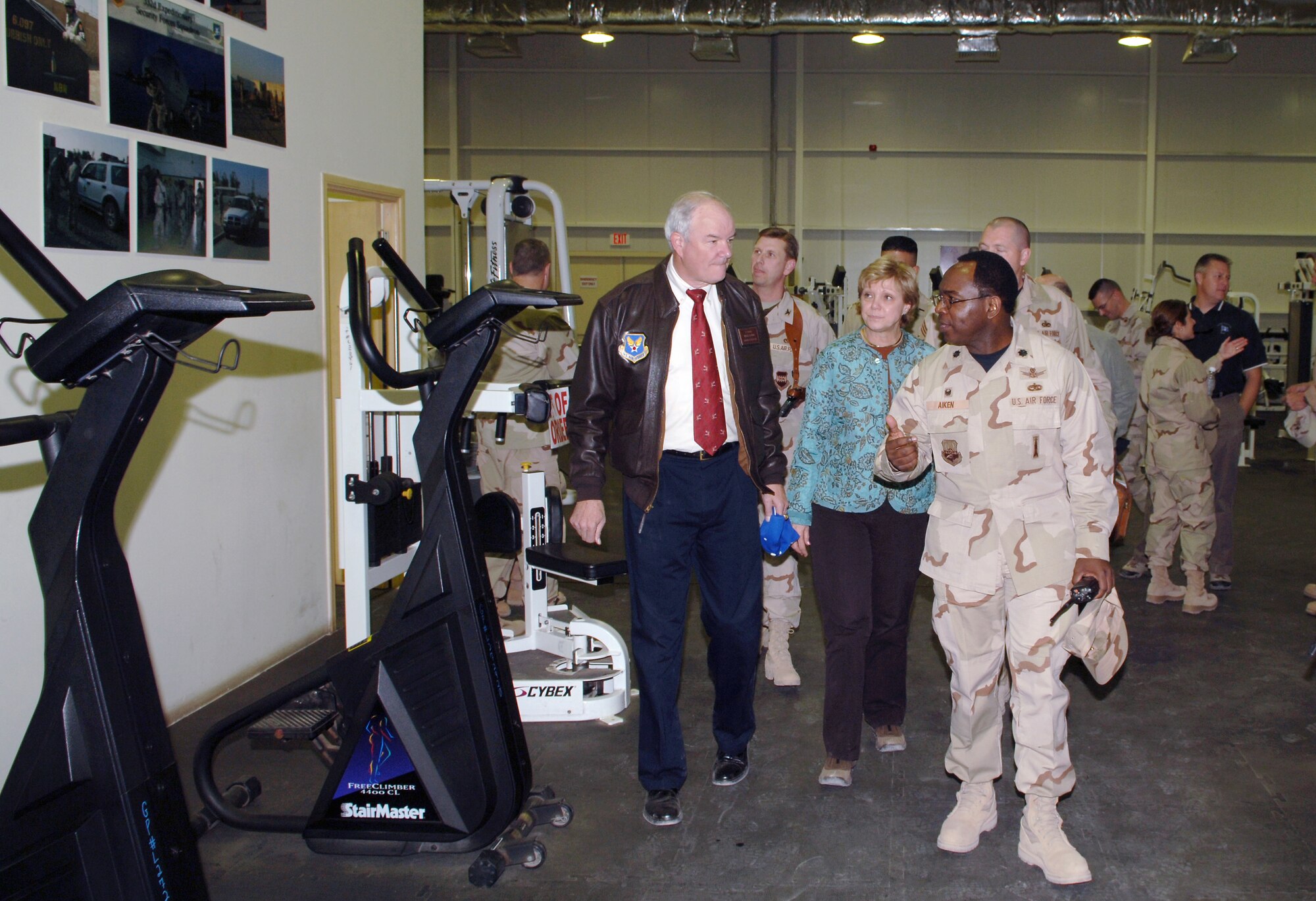 BALAD AIR BASE, Iraq - Secretary of the Air Force Michael Wynne and his wife Barbara receive a tour of the fitness center at Balad Air Base from Lt. Col. Derrick Aiken, 332nd Expeditionary Services commander. Secretary Wynne and Mrs. Wynne visited the base Dec. 9. (U.S. Air Force photo by Tech. Sgt. Paul Cox) 