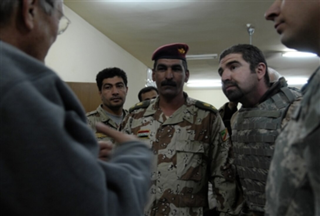 Defense Secretary Donald H. Rumsfeld meets with Iraqi soldiers at Forward Operating Base Hawk during a surprise visit to Iraq, Dec. 9, 2006.