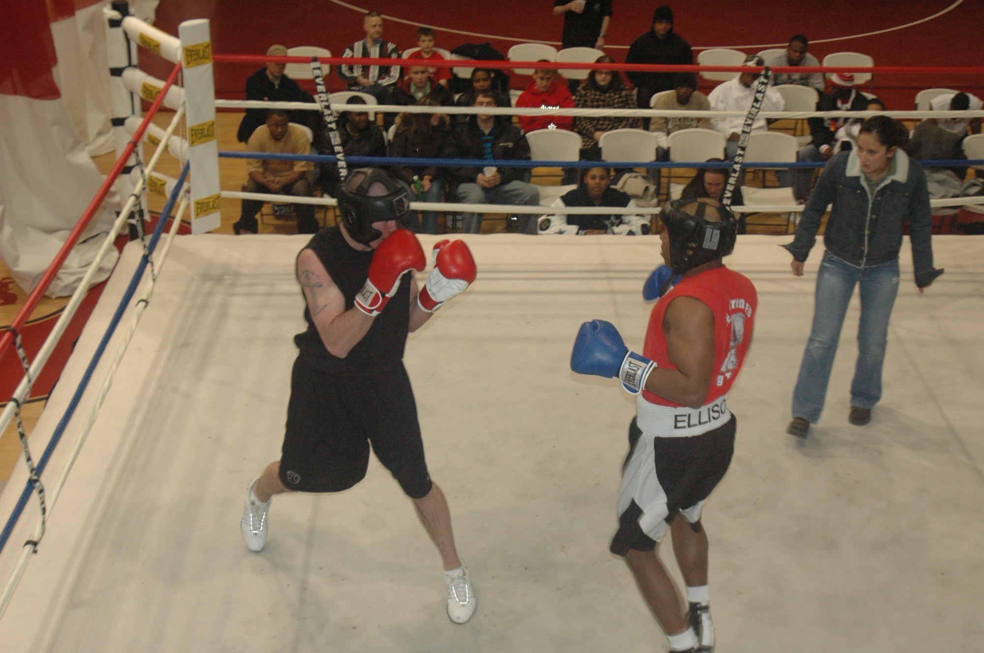 Airman 1st Class Shane Hilliard and Capt. Rodney Ellison wait patiently for the opportunity to attack their opponent during exhibition boxing Dec. 2 in the Fall Hall Community Center.