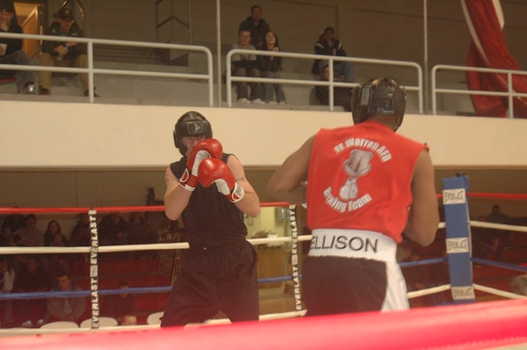 The bout between Airman 1st Class Shane Hilliard and Capt. Rodney Ellison was considered the main event at exhibition boxing in Fall Hall Dec. 2.