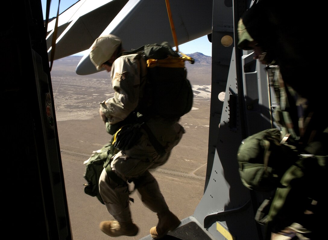 An 820th  Civil Engineer Red Horse member exits a C-17 Globemaster III Dec. 8, during a Mission Employment Exercise held at Nellis Air Force Base, Nev. The ME Phase is the final stage of a five-and a- half month course prior to Weapons School graduation. (U.S. Air Force photo/Master. Sgt. Kevin J. Gruenwald)                     